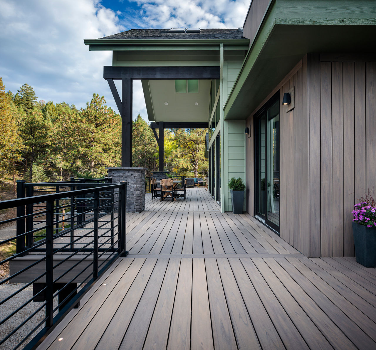 Exterior photography of 2023 HGTV Dream Home in Morrison, Colorado. Photography of Belgard Hardscape products and Trex composite decking and railing.