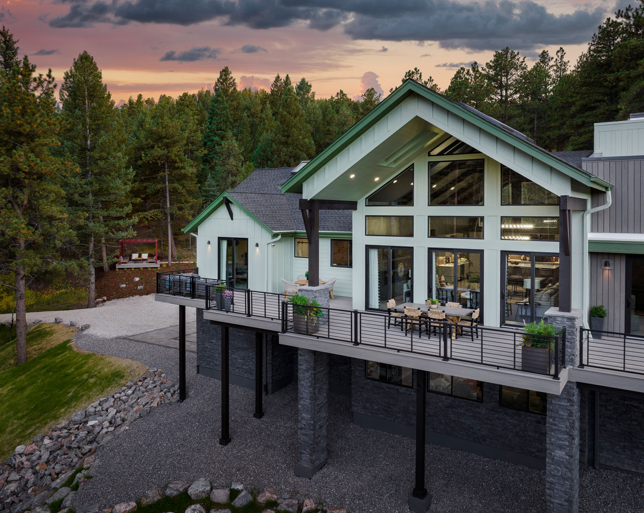 Exterior photography of 2023 HGTV Dream Home in Morrison, Colorado. Photography of Belgard Hardscape products and Trex composite decking and railing.