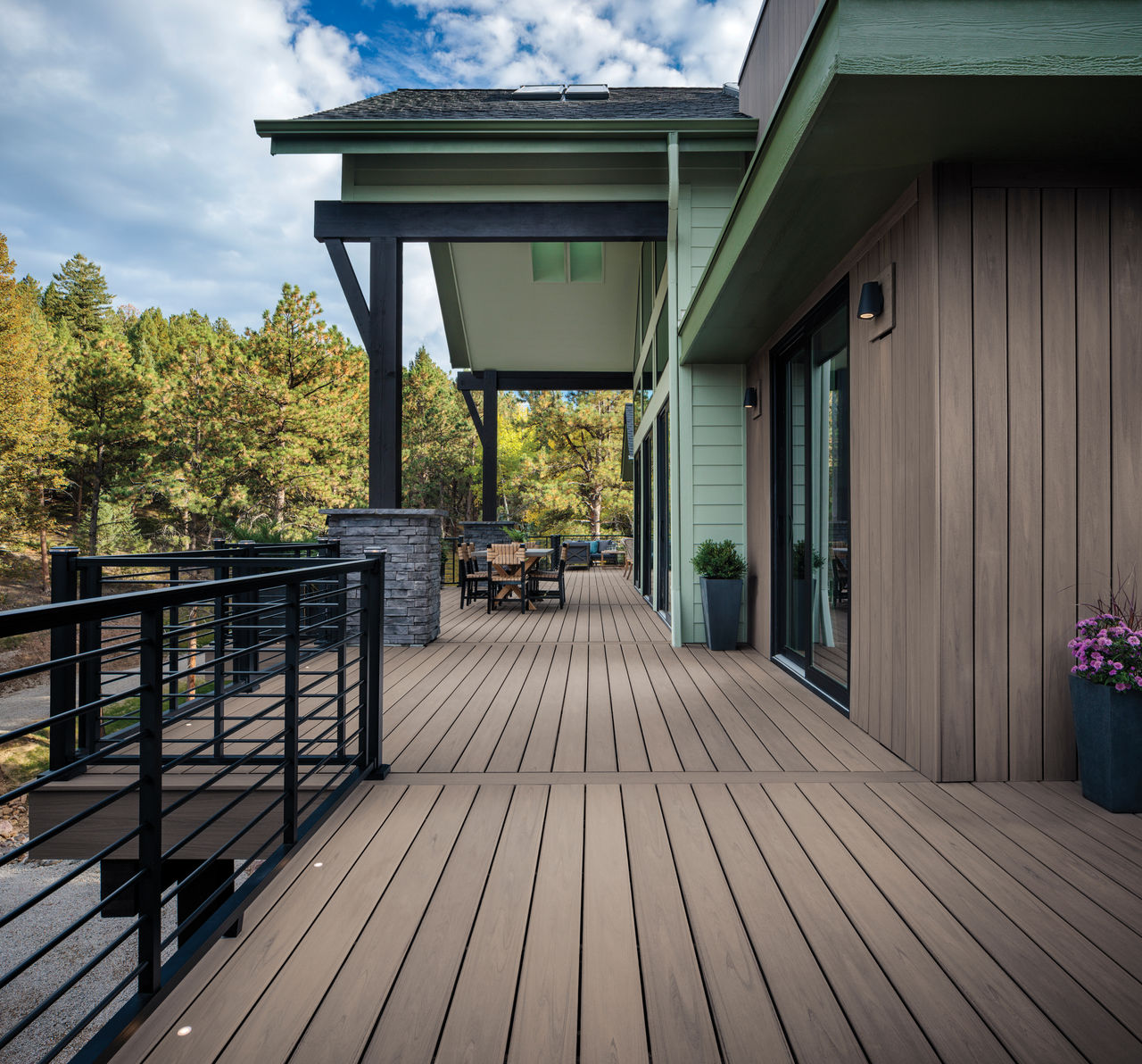 Exterior photography of 2023 HGTV Dream Home in Morrison, Colorado. Photography of Belgard Hardscape products and Trex composite decking and railing.