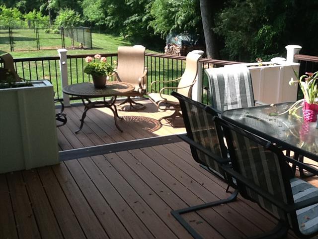 Decked Out Of The Triad Trex Decking Railing Trim Porch Trex Transcend Tiki Torch Decking With Double Vintage Lantern Picture Framing Handrails In Bermuda Run Nc
