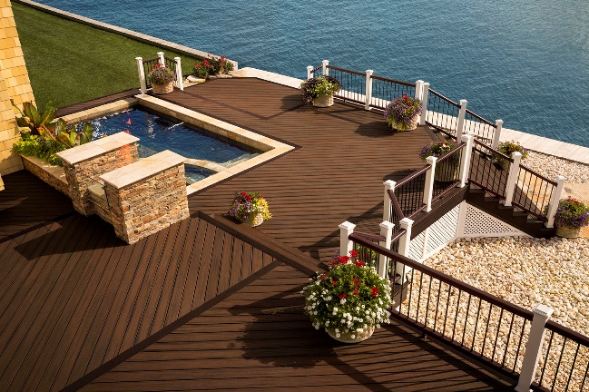 Trex Transcend Spiced Rum decking and Transcend railing make a powerful statement of beauty and durability at this coastal home.